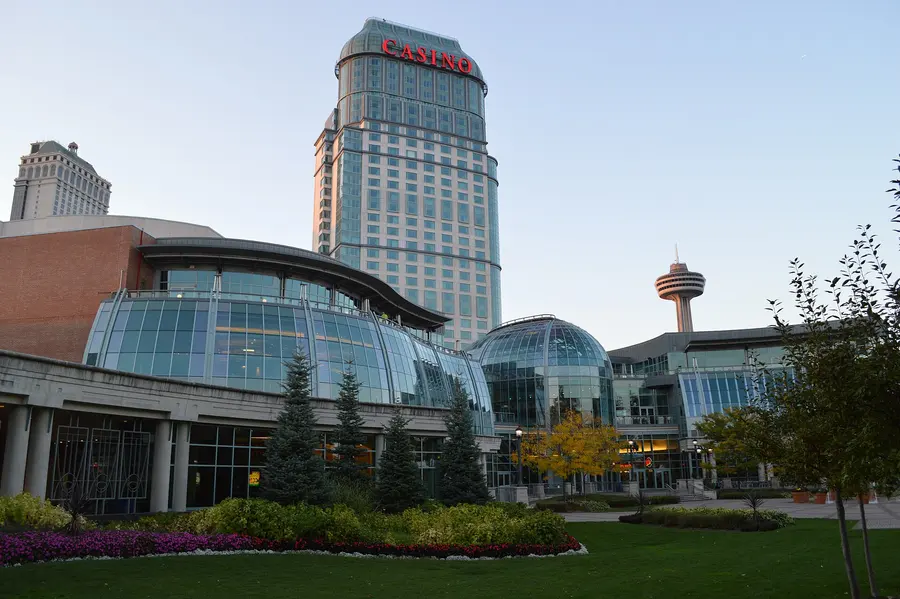 Fallsview Casino Resort by day: the glass-domed casino front and gardens below the hotel tower